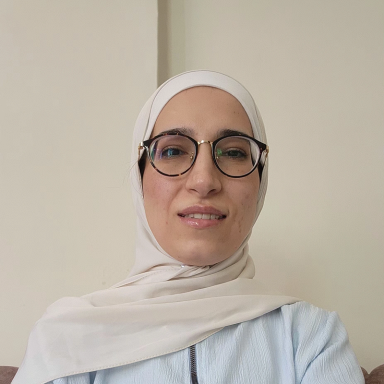 a headshot of rima alakbani